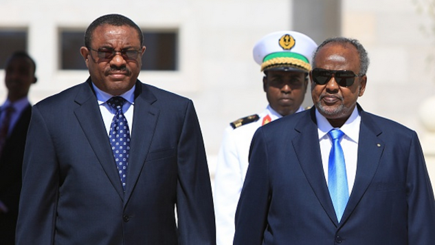THE MEN IN NAVY BLUE: Ethiopian Prime Minister, Hailemariam Desalegn with Djibouti President, Ismaïl Omar Guelleh. If they had their way they would own oil the railway and oil pipelines from East Africa to the Gulf of Guinea. (Photo/AFP).