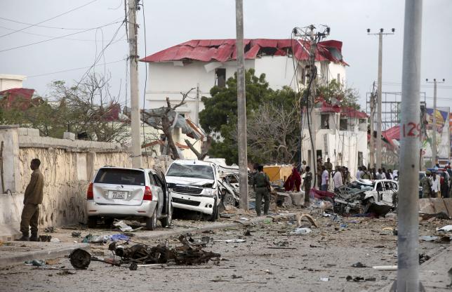 Somali government soldiers stand outside the ruins of the Jazeera hotel after an attack in Somalia's capital Mogadishu, July 26, 2015.