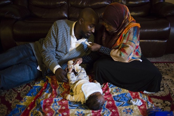 Hamdi and her husband take care of their newborn son, Nimcaan, at their home in Minneapolis, MN, on October 28, 2015.