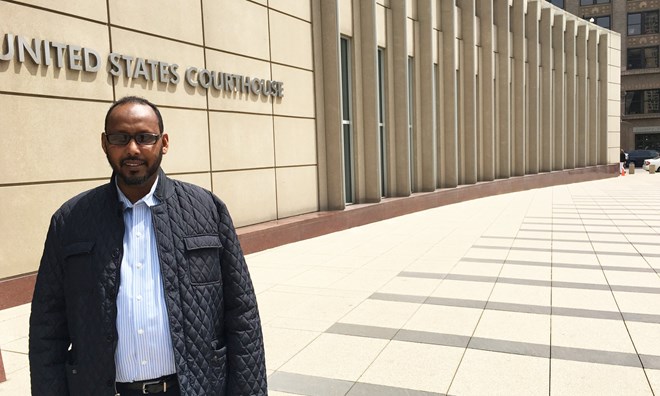 Abdihamid Farah Yusuf stands outside courthouse in Minneapolis.
Photograph: Oliver Laughland for the Guardian
